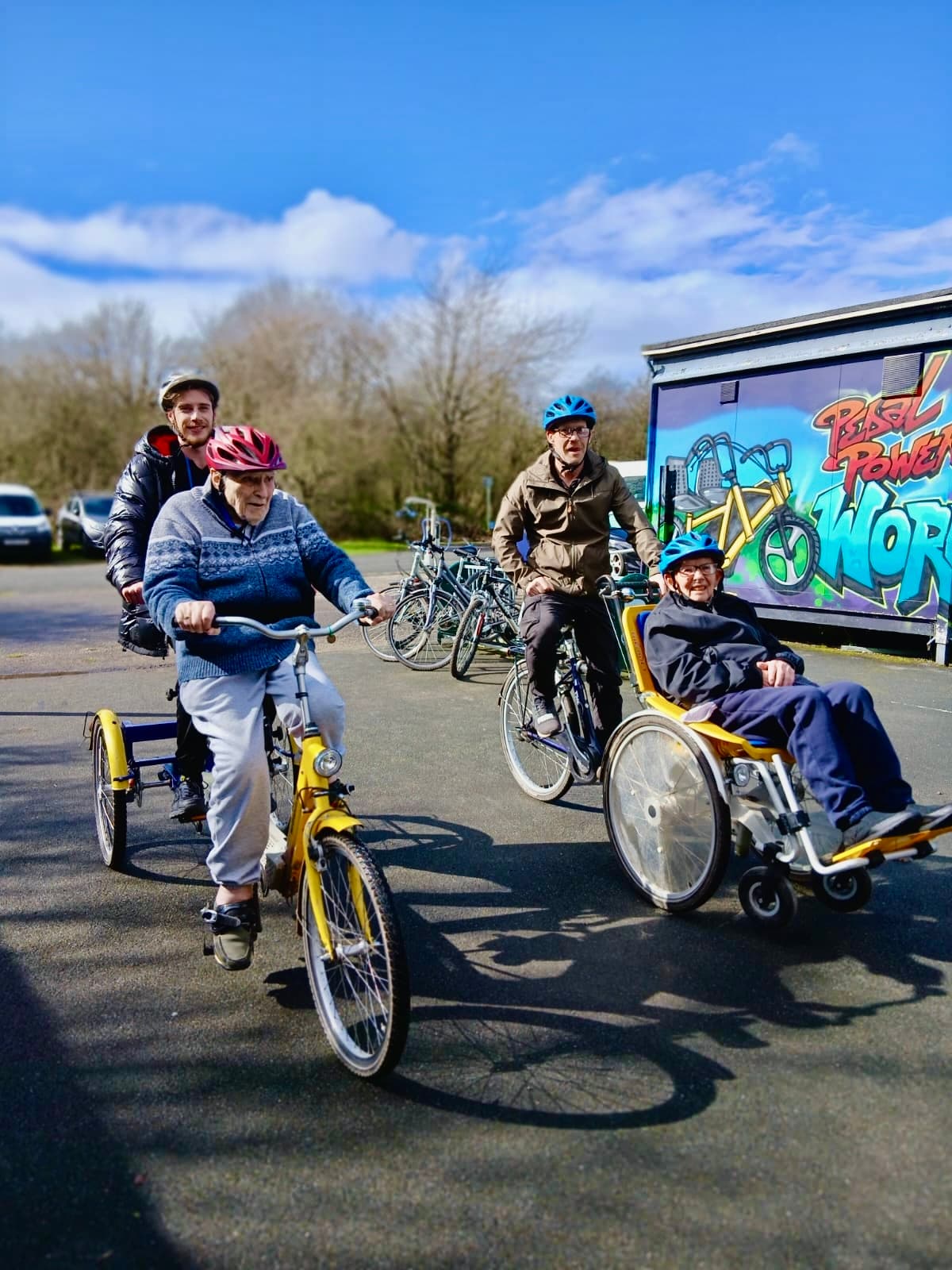 Pedal Power riders and adaptive cycles at the workshop