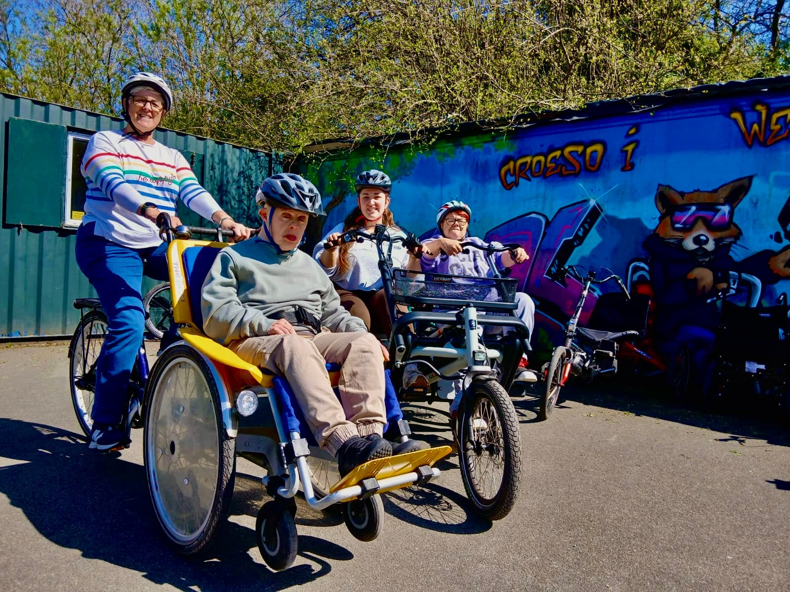 Diverse group of riders on adaptive cycles at Pedal Power